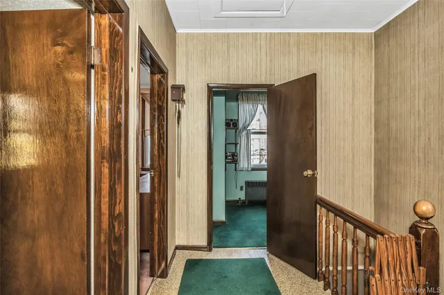 a kitchen with stainless steel appliances granite countertop a stove a refrigerator a sink dishwasher a dining table and chairs with wooden floor