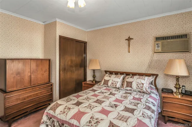 a bedroom with a bed and a chair