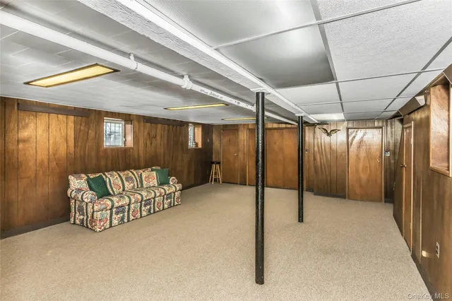 a kitchen with a table chairs refrigerator and stove