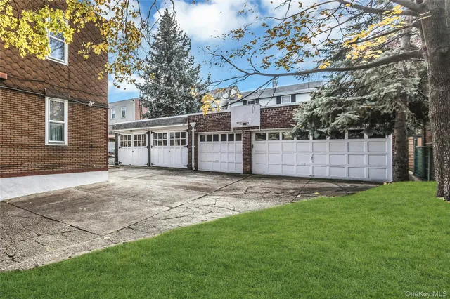 a view of a backyard with a fence and trees