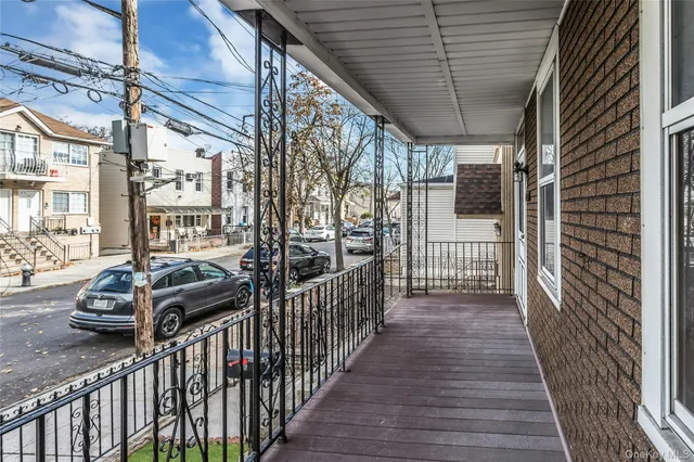 a view of a porch with wooden floor