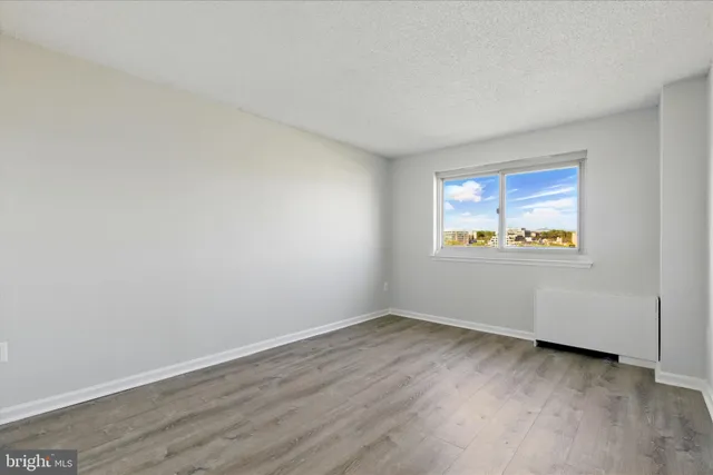 a view of hallway with wooden floor