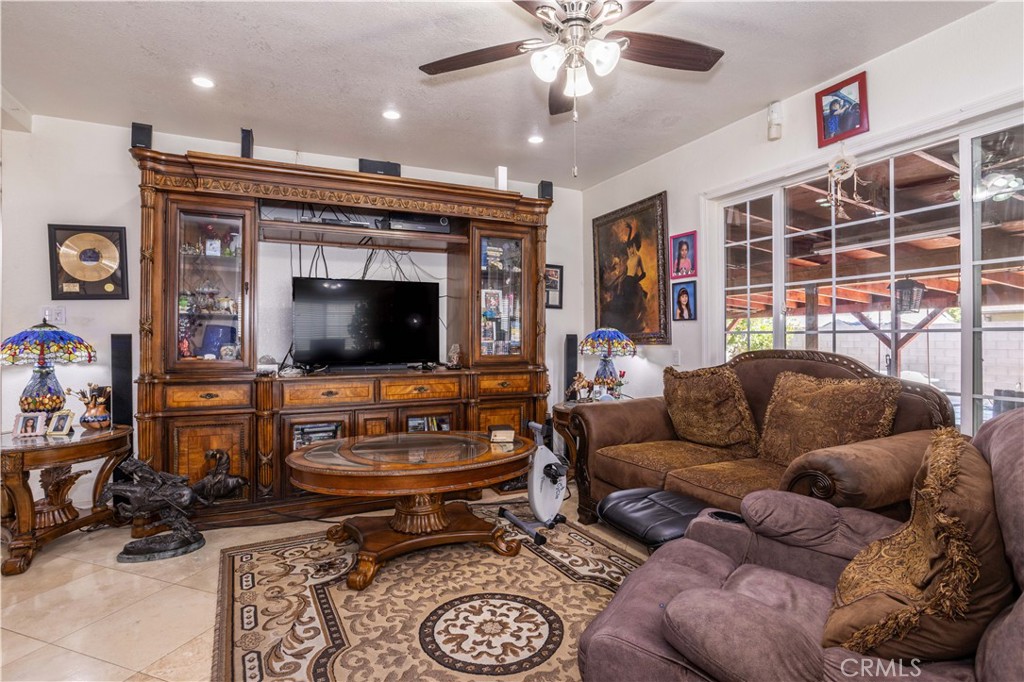 7414 Quartz Avenue Winnetka, CA 91306 - Photo 11 of 42 a living room with furniture and a flat screen tv
