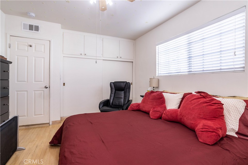 7414 Quartz Avenue Winnetka, CA 91306 - Photo 13 of 42 a bedroom with a bed and a window