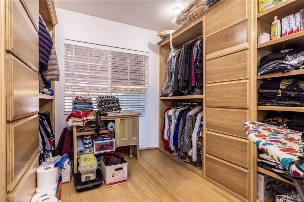 7414 Quartz Avenue Winnetka, CA 91306 - Photo 14 of 42 a view of walk in closet with clothes and shoes