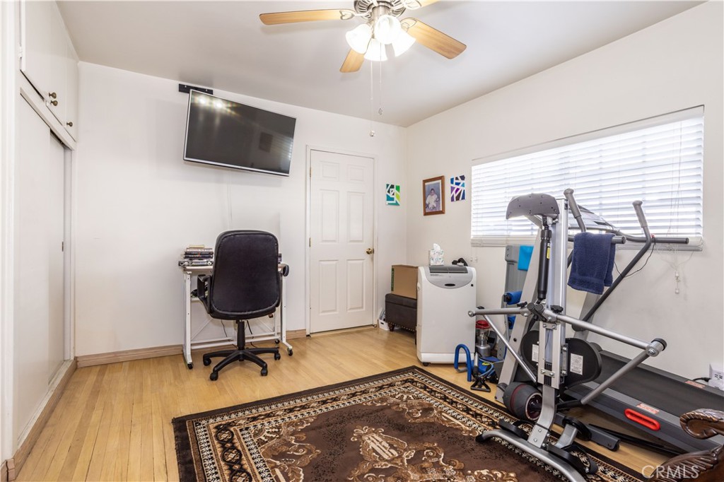 7414 Quartz Avenue Winnetka, CA 91306 - Photo 21 of 42 a view of a workspace with furniture and a window