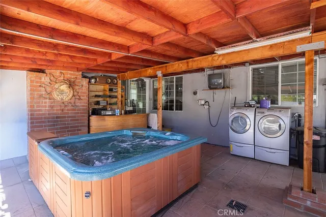 a kitchen with kitchen island a stove and a microwave