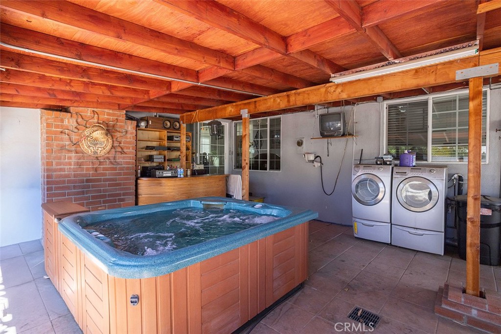 7414 Quartz Avenue Winnetka, CA 91306 - Photo 30 of 42 a kitchen with kitchen island a stove and a microwave