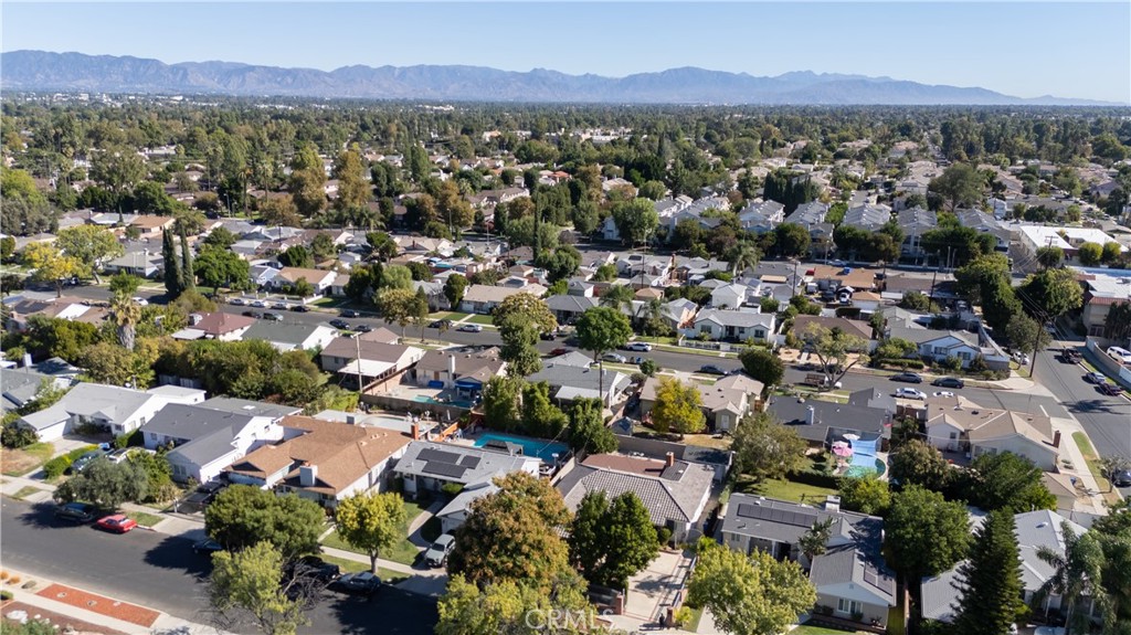 7414 Quartz Avenue Winnetka, CA 91306 - Photo 35 of 42 an aerial view of a city with lots of residential buildings and mountain view in back