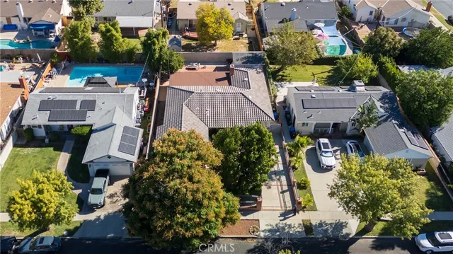 an aerial view of a house with a yard and garden