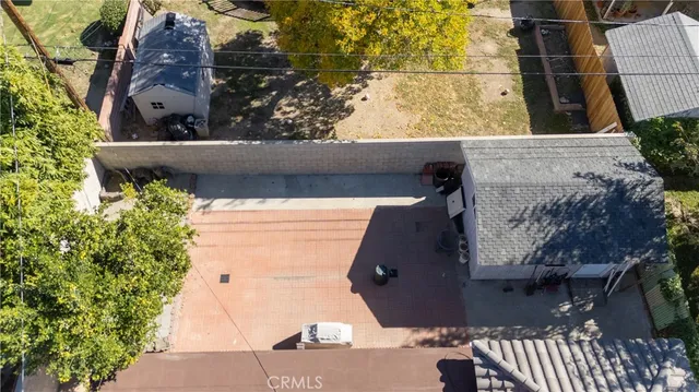 an aerial view of a house with a yard and garden