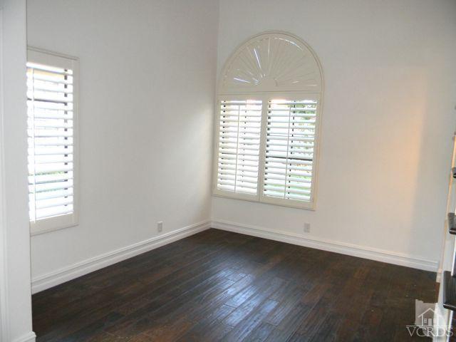 761 Congressional Road Simi Valley, CA 93065 - Photo 2 of 22 an empty room with wooden floor and windows