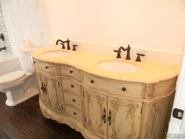 761 Congressional Road Simi Valley, CA 93065 - Photo 11 of 22 a bathroom with a sink and a mirror