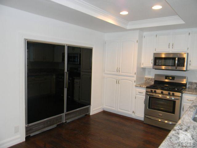 761 Congressional Road Simi Valley, CA 93065 - Photo 3 of 22 a kitchen with a stove and a refrigerator