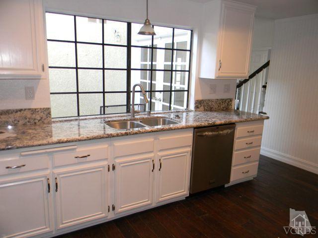 761 Congressional Road Simi Valley, CA 93065 - Photo 7 of 22 a kitchen with granite countertop white cabinets and a sink