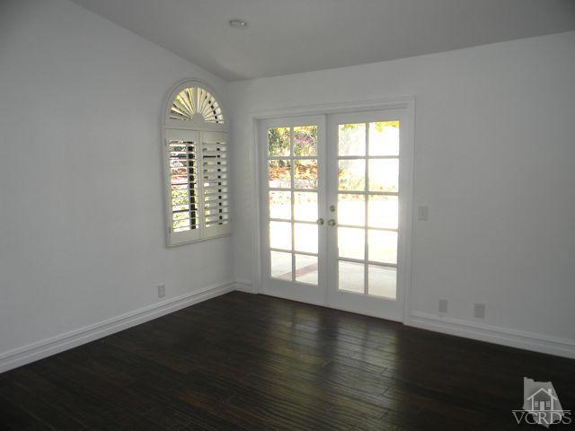 761 Congressional Road Simi Valley, CA 93065 - Photo 10 of 22 an empty room with wooden floor and windows