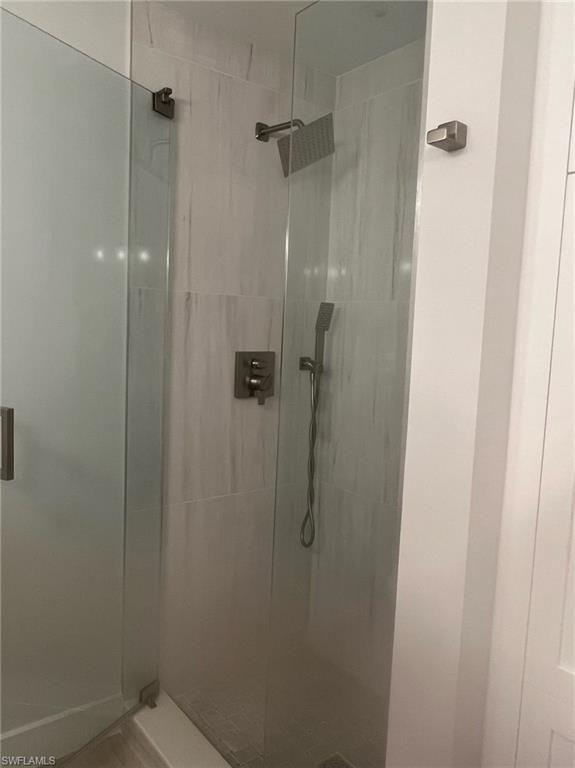 7713 Jewel Lane, Unit 202 Naples, FL 34109 - Photo 9 of 25 a bathroom with a shower