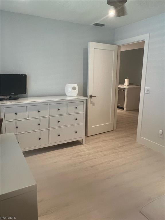 7713 Jewel Lane, Unit 202 Naples, FL 34109 - Photo 12 of 25 a view of an empty room with cabinet
