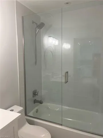 a view of an empty room with cabinet