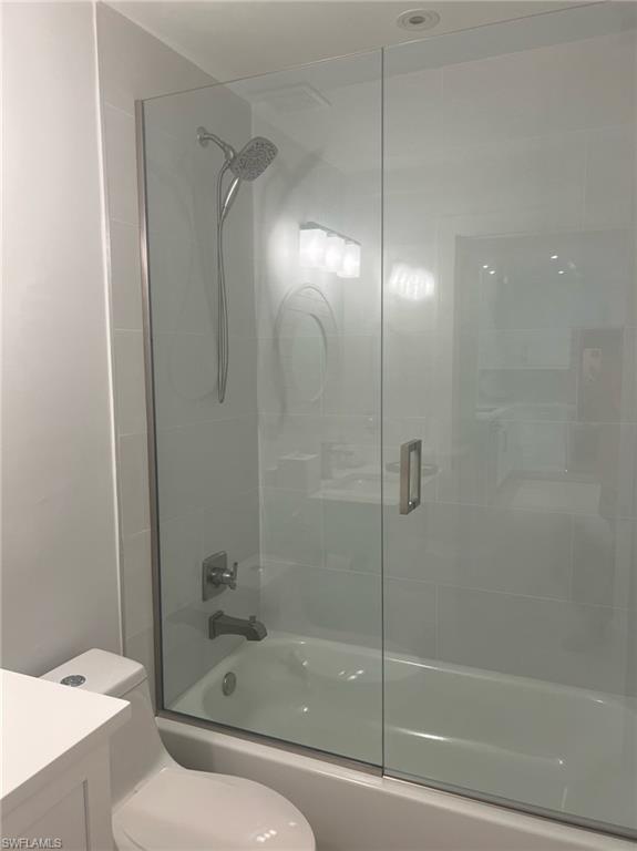 7713 Jewel Lane, Unit 202 Naples, FL 34109 - Photo 14 of 25 a bathroom with a shower and a toilet