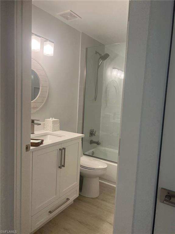 7713 Jewel Lane, Unit 202 Naples, FL 34109 - Photo 16 of 25 a bathroom with a sink toilet and shower