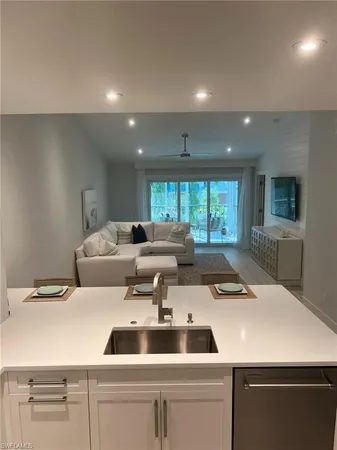 a bedroom with a bed and a machine with wooden floor