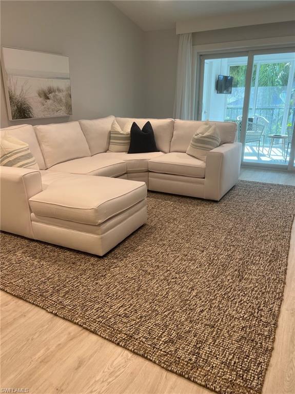 a living room with a couch and a large window