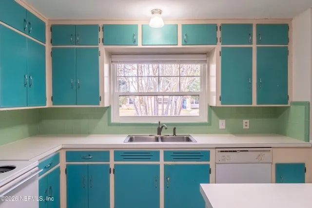 a kitchen with a sink and a window