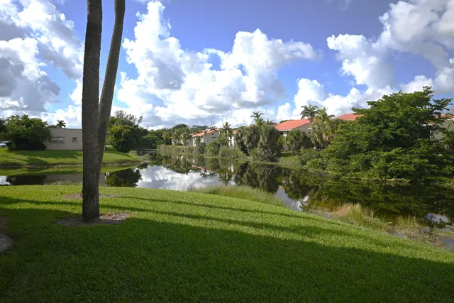 a view of a golf course with a lake