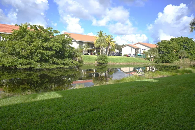 a vase of flowers sitting on a dining table