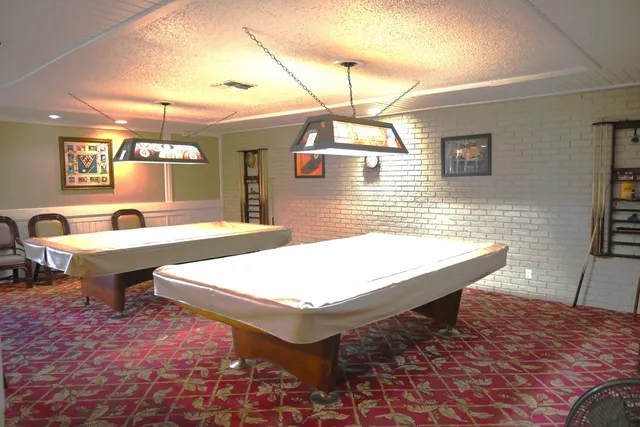 a very nice looking dining room with a large window