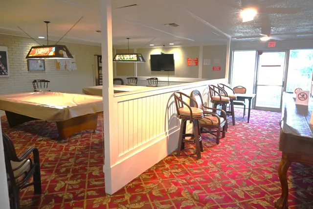 a view of a dining room with furniture and window