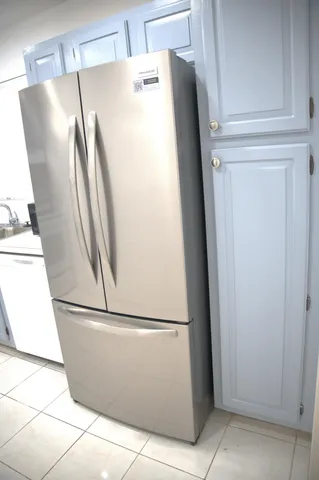 a refrigerator freezer sitting in a kitchen