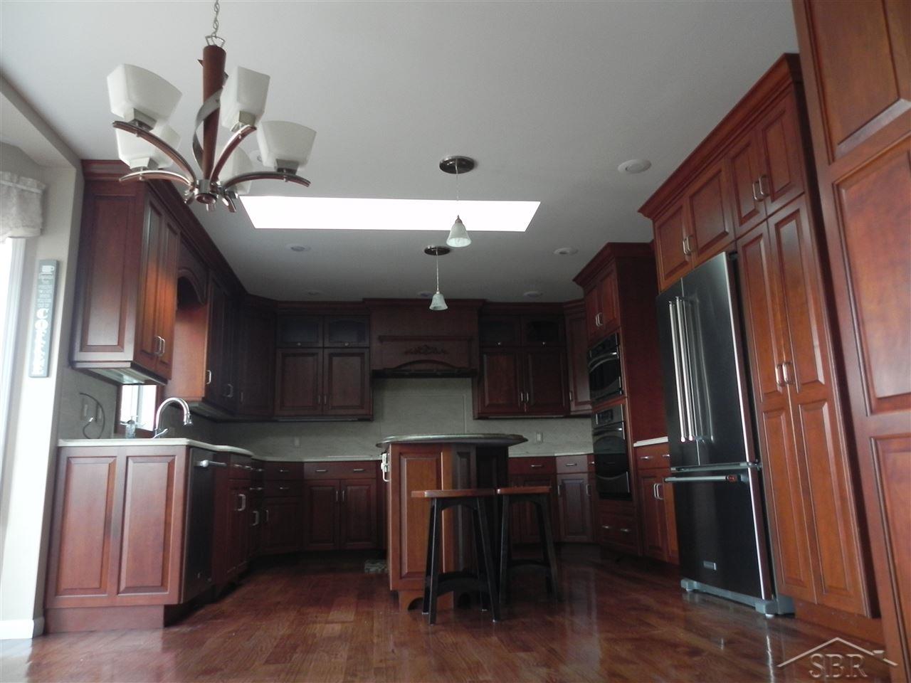 LLOYDS KITCHEN  CABINETS, AWESOME STORAGE,CORIAN COUNTERS, QUARTZ ISLAND