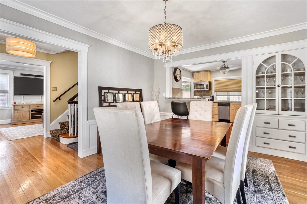 19 Gloria Road Boston, MA 02132 - Photo 12 of 42 a view of a dining room with furniture a chandelier and wooden floor