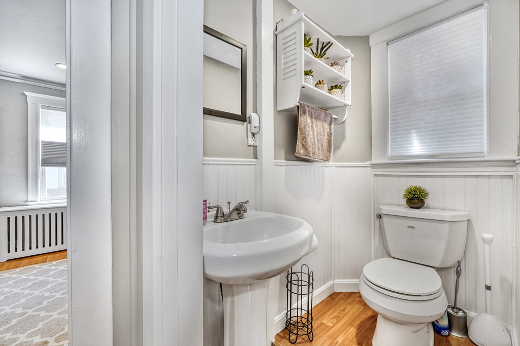 19 Gloria Road Boston, MA 02132 - Photo 18 of 42 a bathroom with a toilet sink and mirror