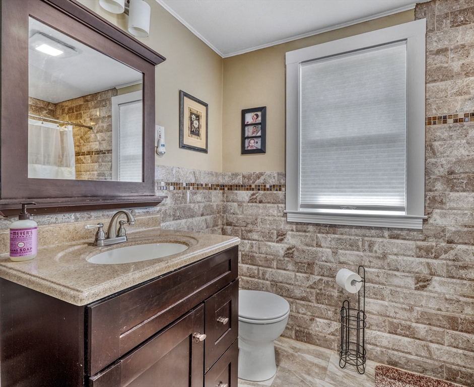 19 Gloria Road Boston, MA 02132 - Photo 23 of 42 a bathroom with a sink and a toilet