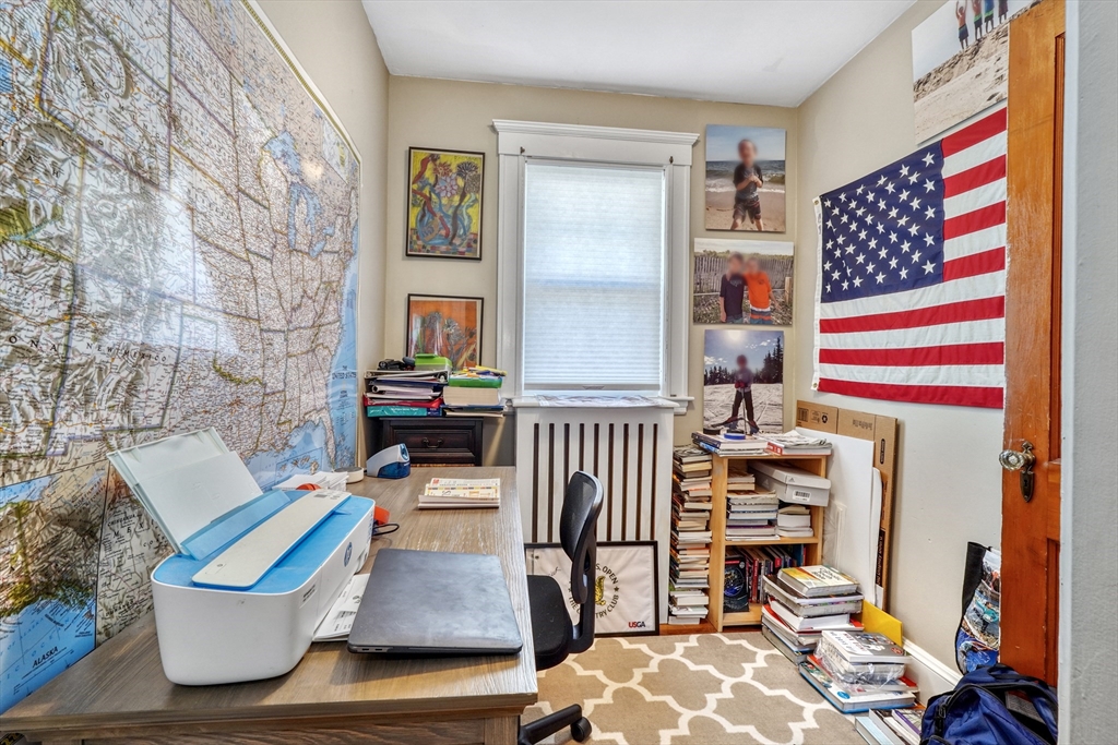 19 Gloria Road Boston, MA 02132 - Photo 26 of 42 a living room with furniture and stairs
