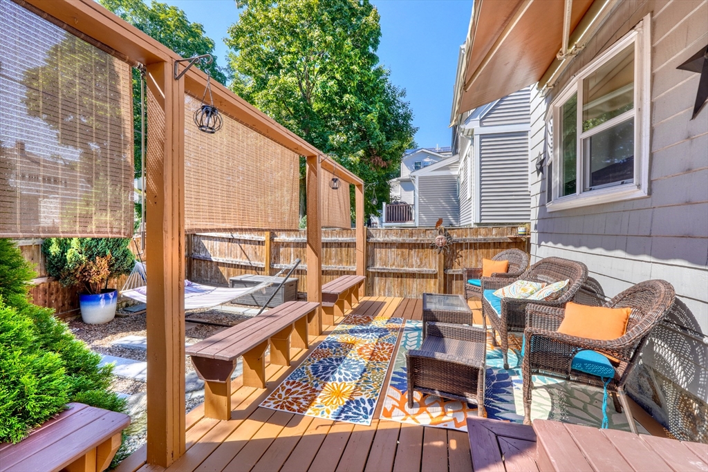 19 Gloria Road Boston, MA 02132 - Photo 30 of 42 a view of a balcony with chairs and a potted plant