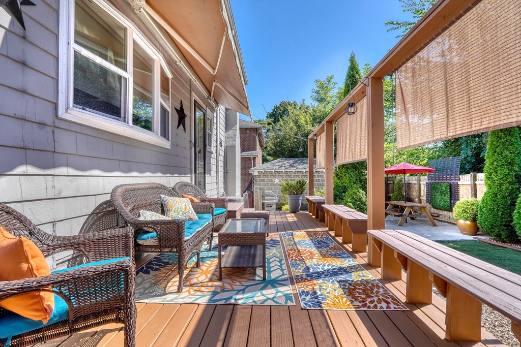19 Gloria Road Boston, MA 02132 - Photo 31 of 42 a view of balcony with wooden floor and outdoor seating