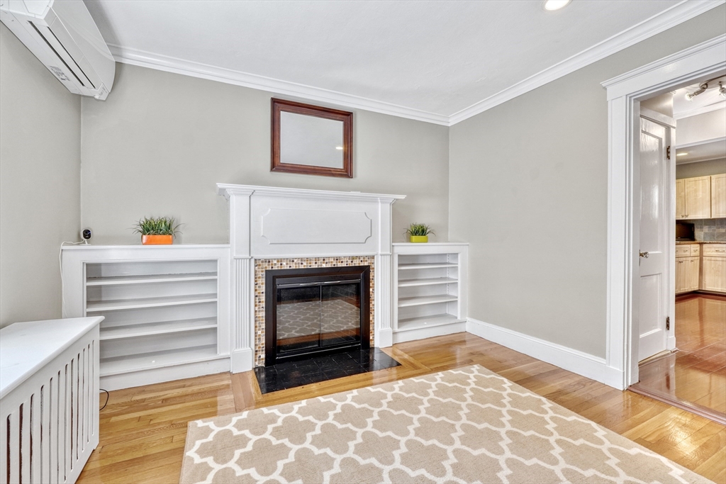 19 Gloria Road Boston, MA 02132 - Photo 8 of 42 a living room with furniture and a fireplace