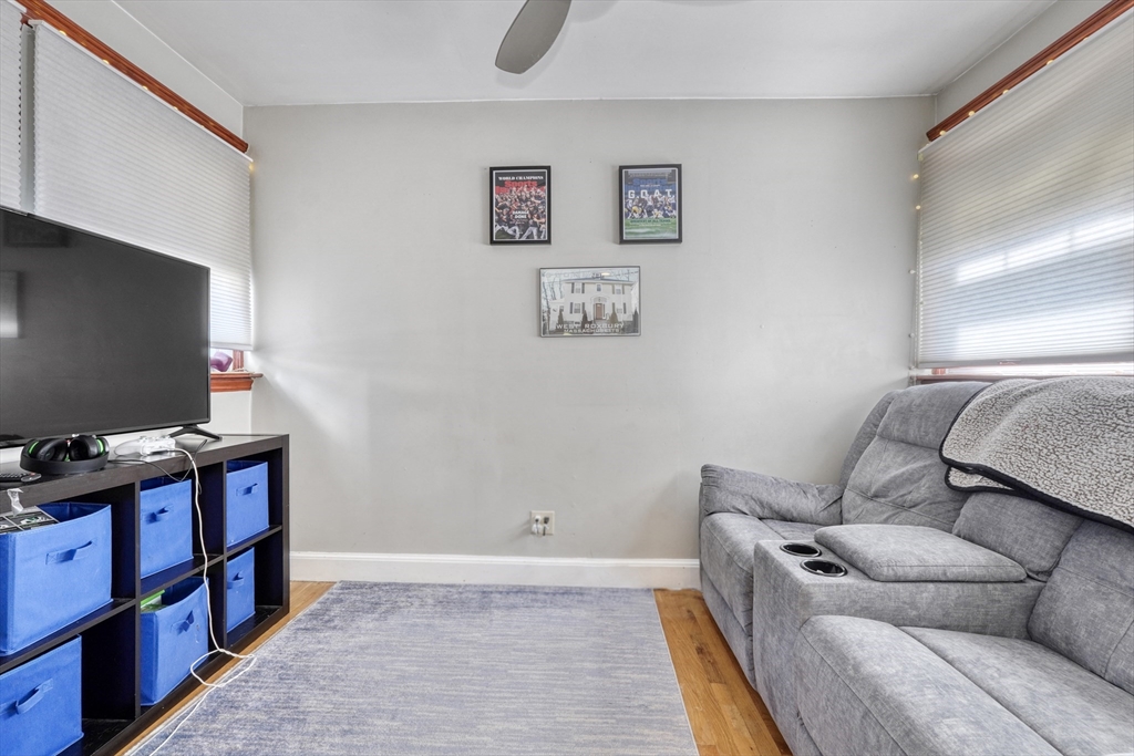 19 Gloria Road Boston, MA 02132 - Photo 10 of 42 a living room with furniture and a flat screen tv