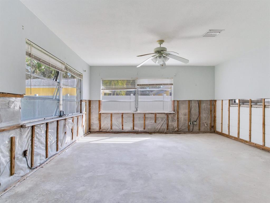 16105 1st Street East Redington Beach, FL 33708 - Photo 20 of 27 a view of an empty room with a window