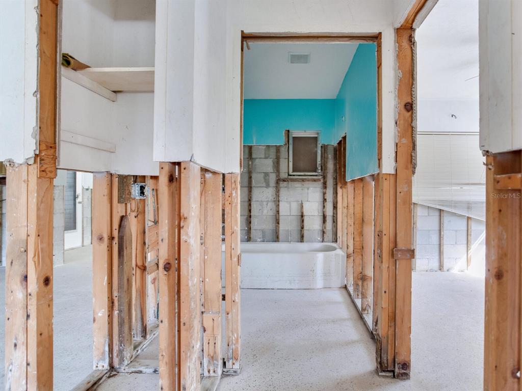 16105 1st Street East Redington Beach, FL 33708 - Photo 21 of 27 a bathroom with a bathtub and a shower