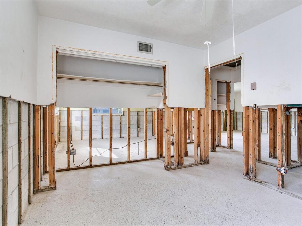 16105 1st Street East Redington Beach, FL 33708 - Photo 23 of 27 a view of a utility room with lots of white walls