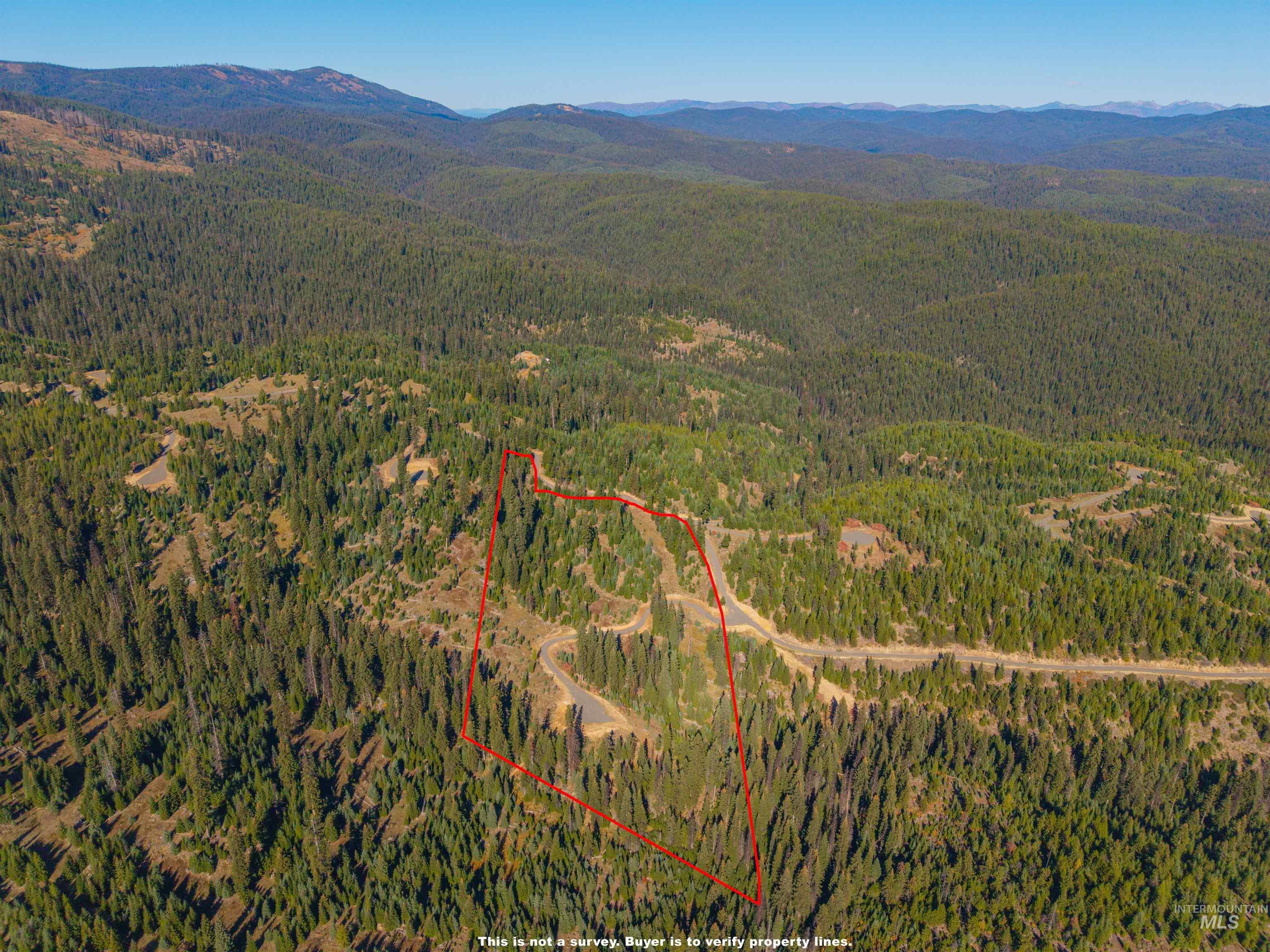 5 Tree Farm Trails Road Elk City, ID 83525 - Photo 1 of 13 Aerial view of property's location with a mountain backdrop and property boundaries highlighted