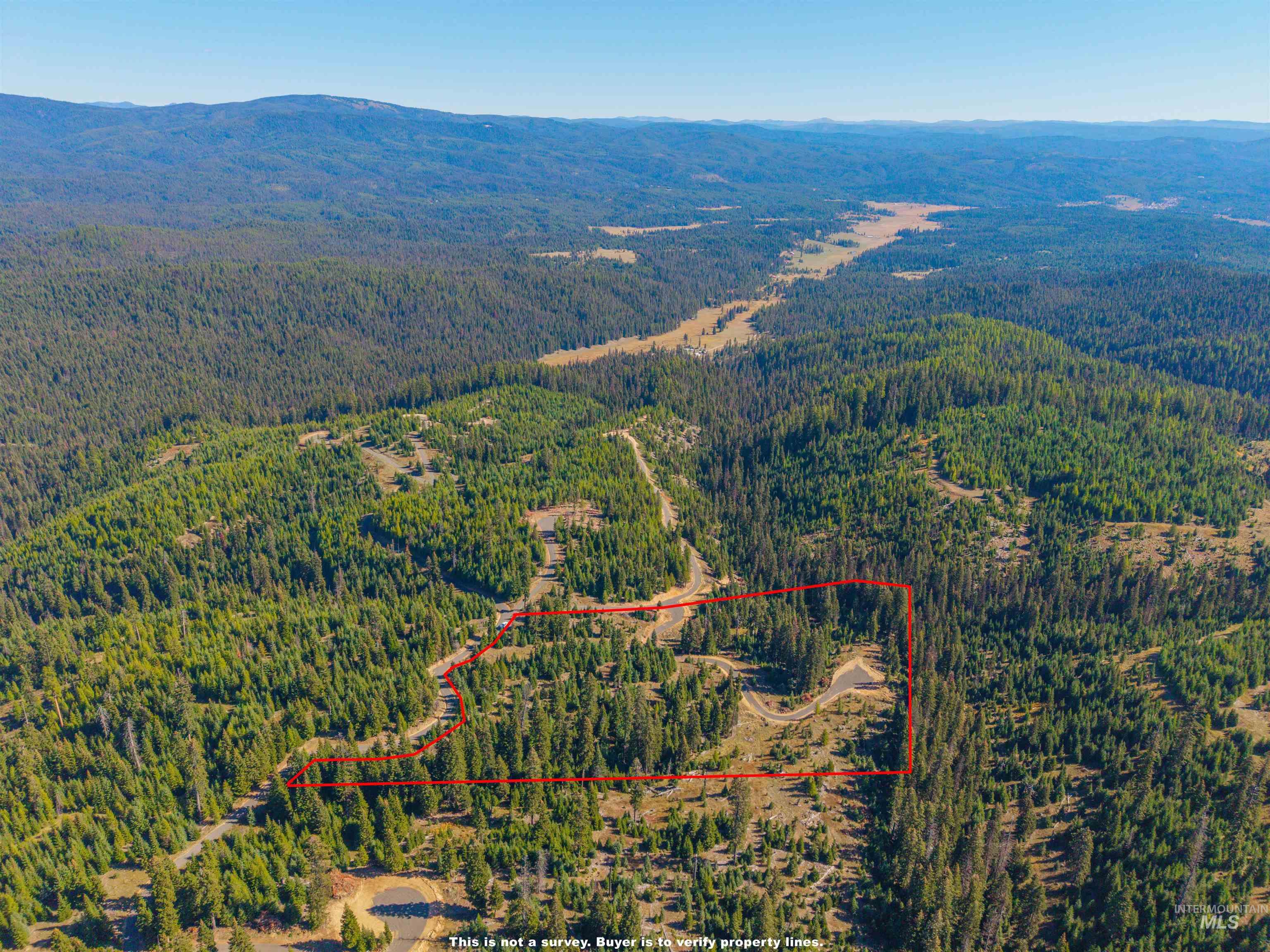5 Tree Farm Trails Road Elk City, ID 83525 - Photo 13 of 13 Aerial view of property and surrounding area with a mountain backdrop and property boundaries highlighted