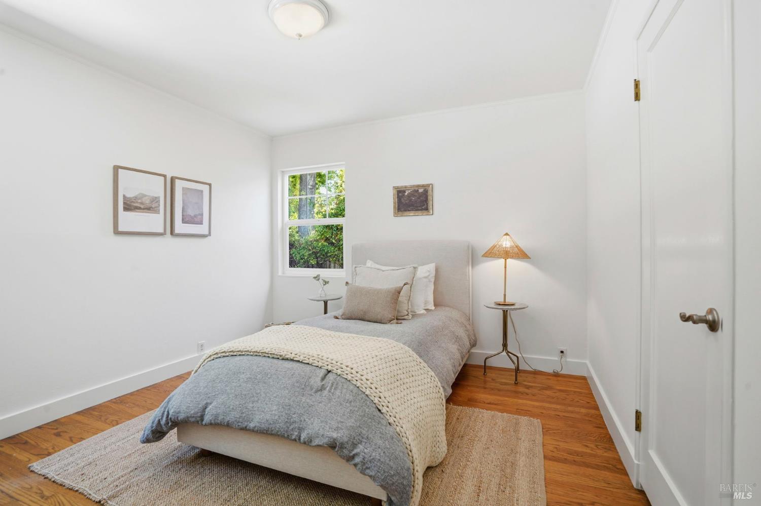 234 Solano Street San Rafael, CA 94901 - Photo 13 of 24 a bedroom with a bed and a night stand