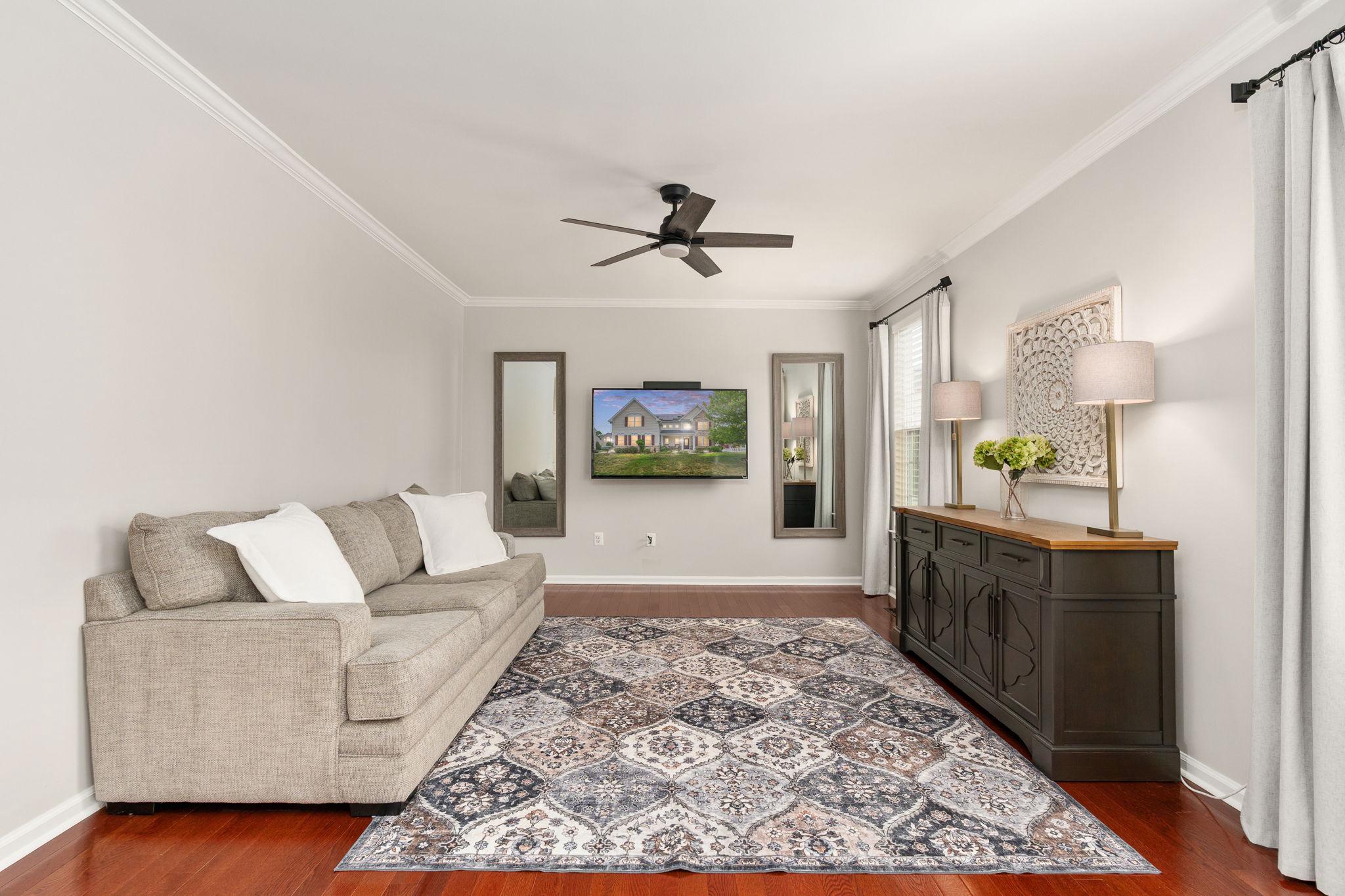 9417 Reservoir Road Fredericksburg, VA 22407 - Photo 23 of 76 a living room with furniture and a rug