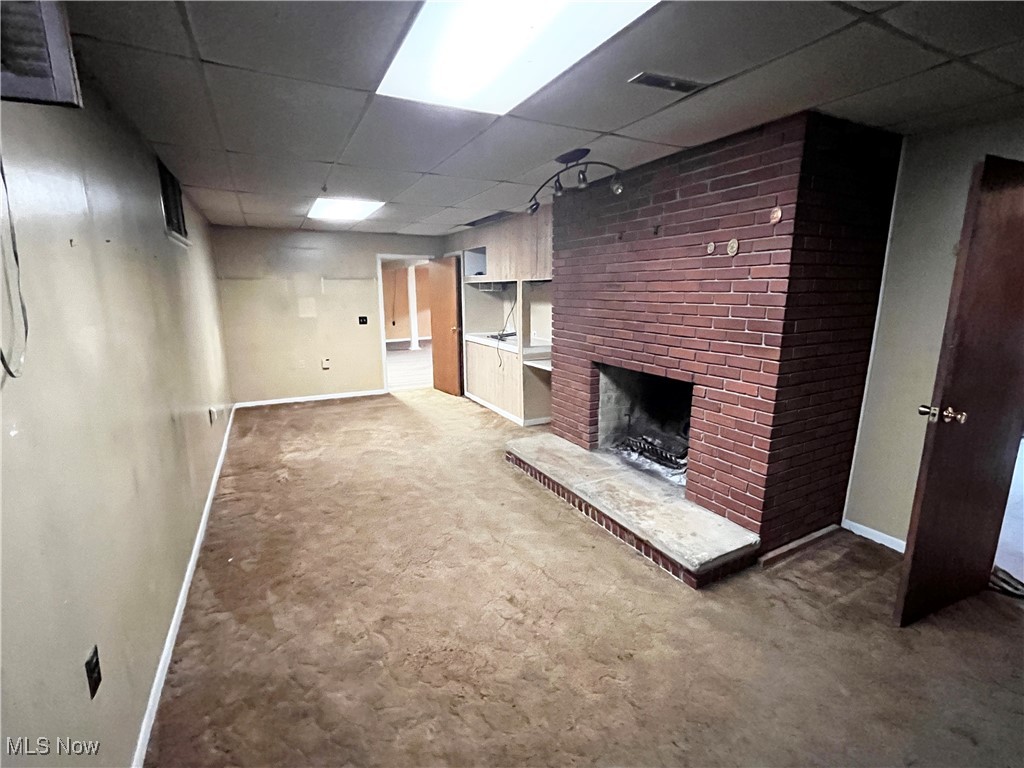 2300 River Road Willoughby, OH 44094 - Photo 28 of 28 Finished below grade area featuring a paneled ceiling, light carpet, and a fireplace